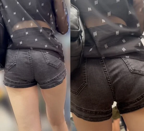 デニムのショートパンツに美脚がセクシーな美女